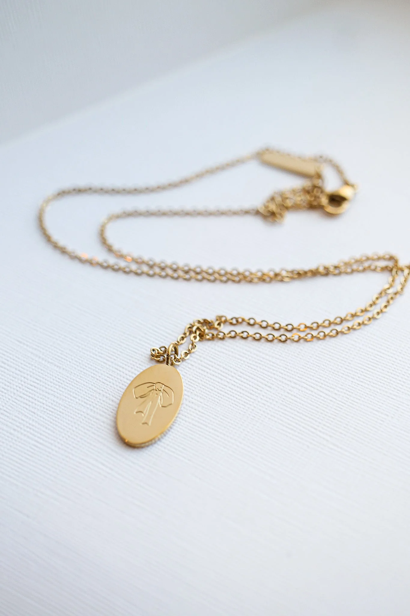 Bow Pendant Necklace in Gold - Image 7